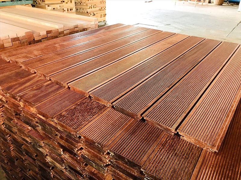 Installed hardwood decking boards in sunlight